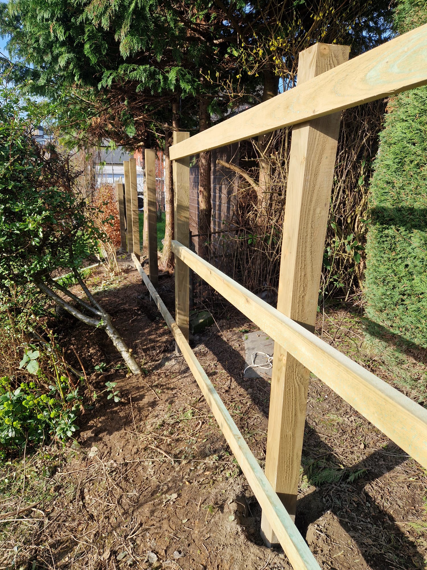 Bare timber fence frame before boards fitted