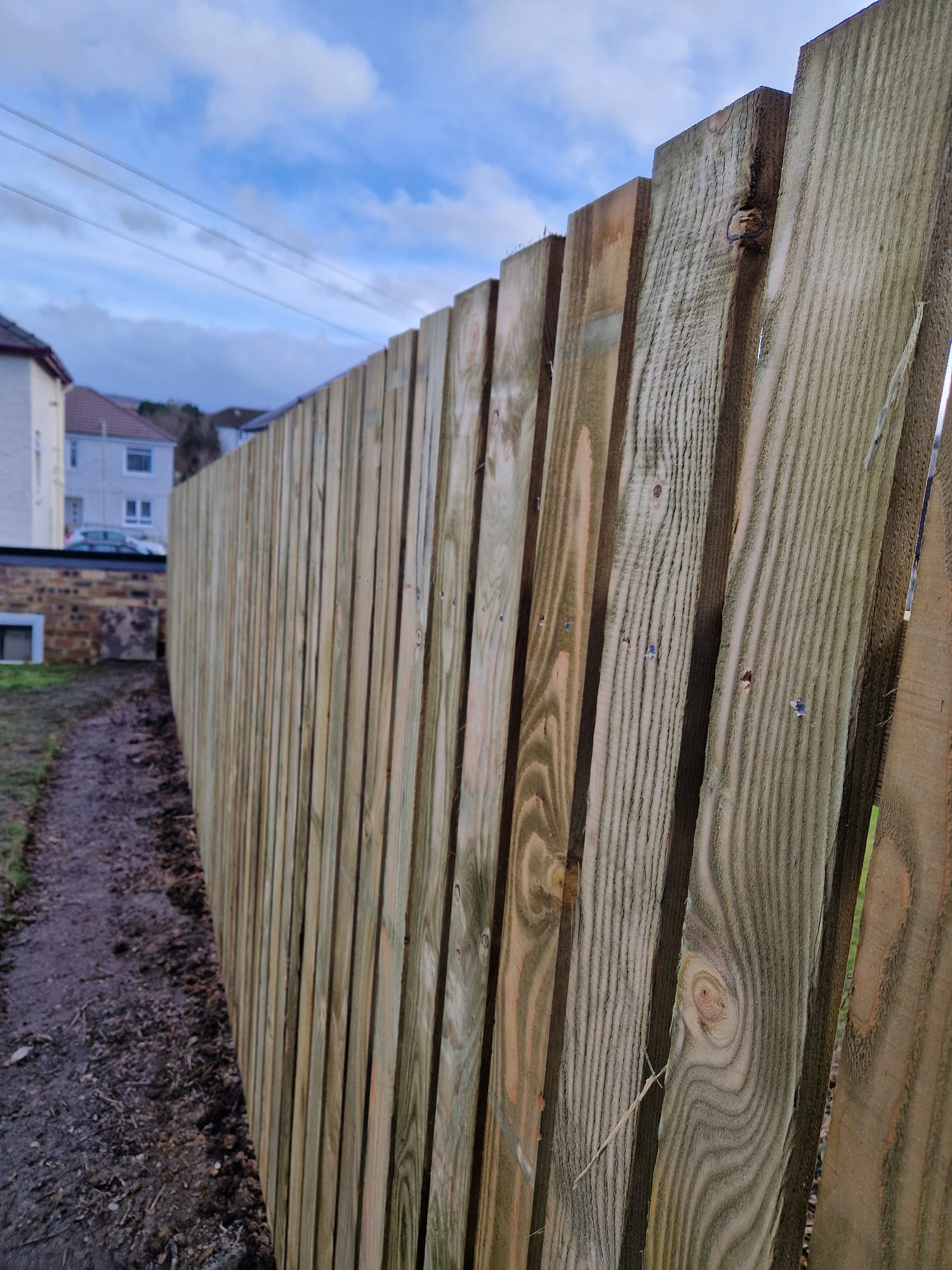 Completed close-board timber fence — full replacement